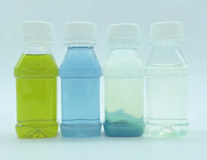 Figure 2: Left to right: untreated water with dissolved Cr(VI) (yellow), treated water with dissolved Cr(III) (blue-green), treated water with precipitated Cr(III) (cloudy blue-green), filtered water (clear).